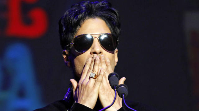 Singer Prince gestures as he announces upcoming live dates at the Apollo Theater in New York Oct. 14, 2010. 
