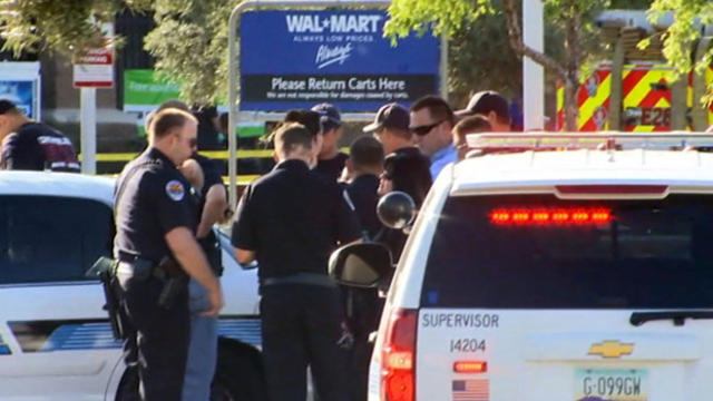 ​Police officers work the scene after a shooting at a Walmart in Chandler, Arizona, on April 23, 2016. 