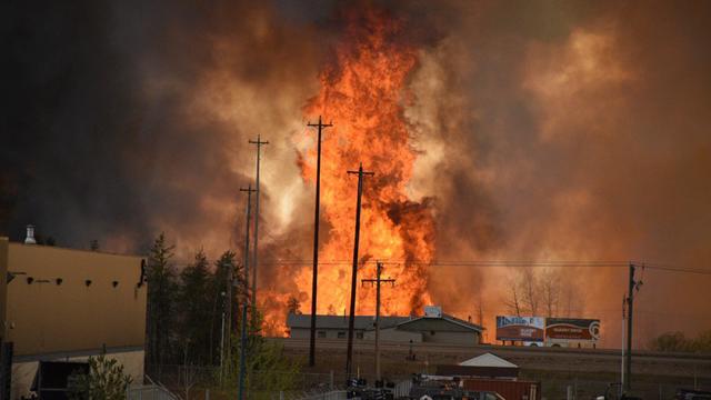 Flames rise in an industrial area south Fort McMurray, Alberta, Canada, on May 3, 2016. 