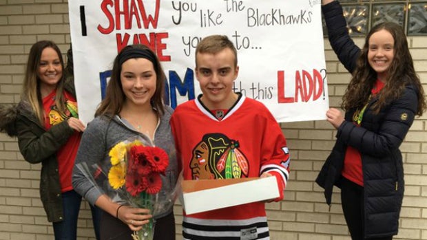 ​Colleen Doyle and Tom Erickson pose for a picture with his sisters after Tom asked Colleen to prom. 