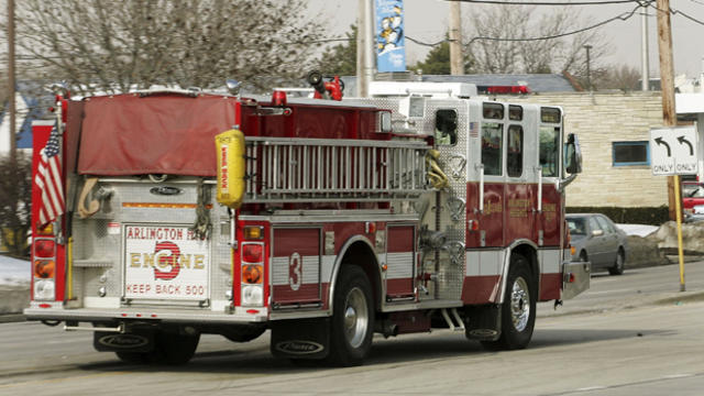 A fire truck drives down a street en route to a call Jan. 31, 2005, in Arlington Heights, Illinois. 