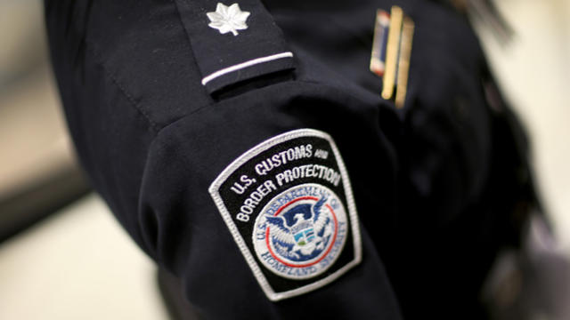 A U.S. Customs and Border Protection officer's patch is seen as the agency unveils a new mobile app for international travelers arriving at Miami International Airport on March 4, 2015, in Miami, Florida. 