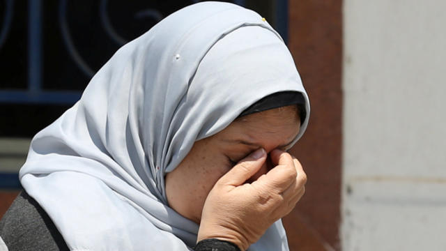 ​An unidentified woman reacts as she waits outside the EgyptAir in-flight service building, where relatives and friends of passengers who were flying in an EgyptAir plane that vanished from radar en route from Paris to Cairo are being held, at Cairo Inter 