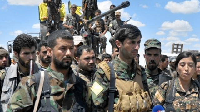 ​Members of the U.S.-backed Syrian Democratic Forces gather to speak to reporters as they announce an operation to retake Raqqa, Syria, back from the Islamic State of Iraq and Syria (ISIS) 