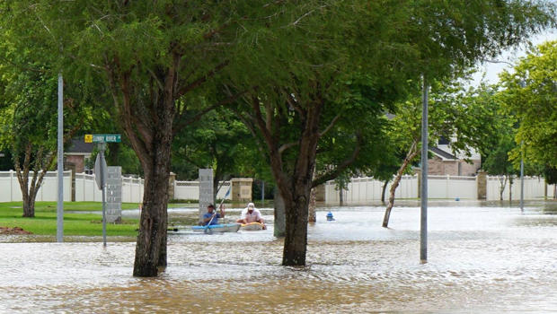 People use kayaks in floodwaters in Fort Bend County after heavy rainfall caused the Brazos River to surge to its highest level causing flooding outside Houston, Texas, in this picture taken June 1, 2016, courtesy of the Fort Bend County Sheriff's Office. 