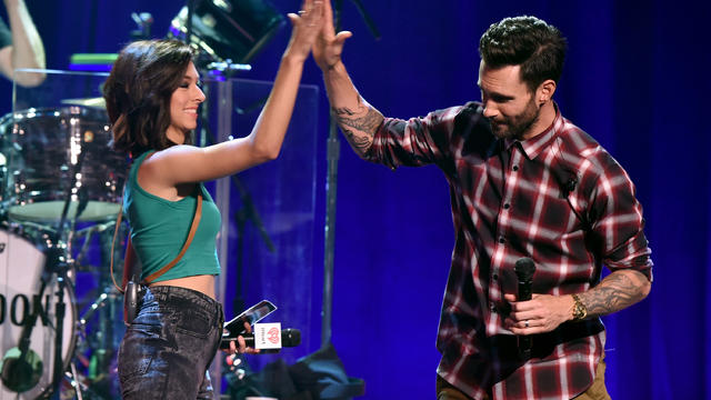 Singers Christina Grimmie and Adam Levine speak onstage during the iHeartRadio Album Release Party with Maroon 5 on the CW at iHeartRadio Theater on Aug. 26, 2014, in Burbank, California. 