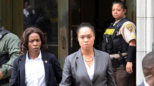 State's Attorney Marilyn Mosby, center, departs the courthouse in Baltimore, Maryland, on June 23, 2016, after Officer Caesar Goodson was found not guilty of all charges related to the death of Freddie Gray. 