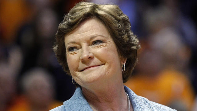 January 2013 file photo shows former Tennessee women's basketball coach Pat Summitt smiling as banner is raised in her honor before team's game against Notre Dame in Knoxville, Tennessee 