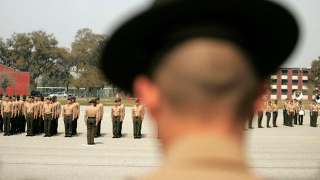 A United States Marine Corps drill instructor watches recruits on the parade deck during boot camp on March 8, 2007, at Parris Island, South Carolina. 