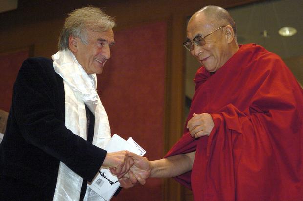 The Dalai Lama greets fellow Nobel laureate Elie Wiesel after Wiesel's remarks upon receiving the International Campaign for Tibet's Light of Truth Award at a ceremony in Washington, D.C., on Nov. 15, 2005. Wiesel was honored for his practical work in pea 