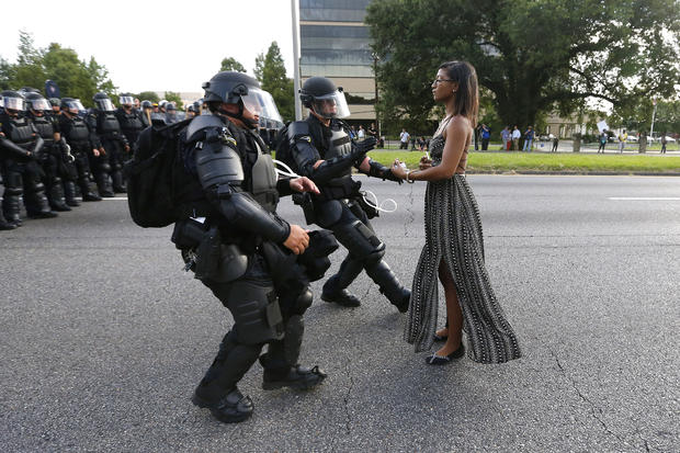A demonstrator protesting the shooting death of Alton Sterling is detained by law enforcement near the headquarters of the Baton Rouge Police Department in Baton Rouge, Louisiana, July 9, 2016. 