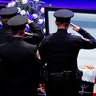 Police officers pay their respects ahead of the funeral for Officer Lorne Ahrens in Plano, Texas, on July 13, 2016. Five officers, including Ahrens, were killed in a shooting incident in Dallas on July 7, 2016. 