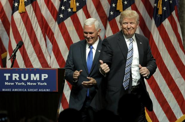 Republican presidential candidate Donald Trump points to Indiana Gov. Mike Pence after introducing Pence as his vice presidential running mate in New York City July 16, 2016. 