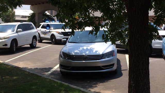 ​Crews work the scene after a 1-year-old girl was left in a car for several hours in Birmingham, Alabama, on July 21, 2016. 