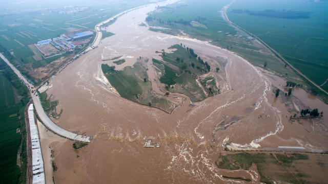 An aerial view shows flooded roads and fields in Xingtai, Hebei province, China, July 21, 2016.​ 