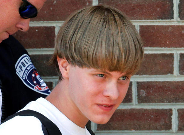 Police lead suspected shooter Dylann Roof into the courthouse in Shelby, North Carolina, on June 18, 2015. 