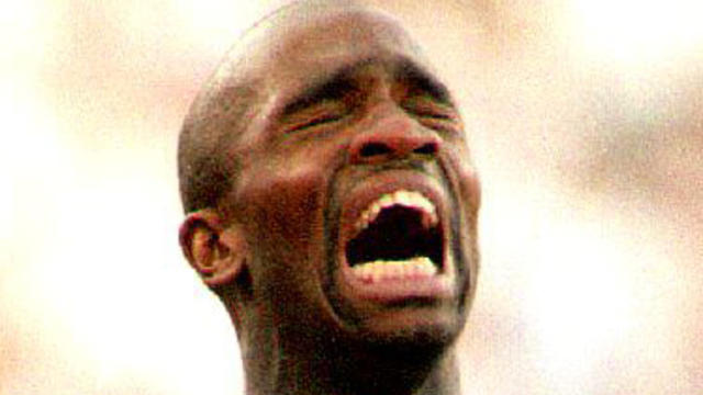 Derek Redmond of Great Britain is helped by his father Aug. 3, 1992, in Barcelona, Spain, after suffering a torn hamstring during a second-round heat of the men's 400-meter run at the 1992 Summer Olympics. 