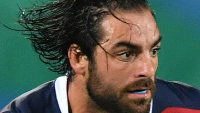 USA's Nate Ebner runs with the ball in the men's rugby sevens match between USA and Brazil during the Rio 2016 Olympic Games at Deodoro Stadium in Rio de Janeiro on Aug. 9, 2016. 