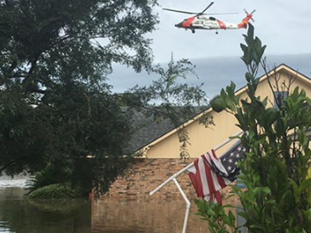 ​Coast Guard chopper flies over flooding in Baton Rouge, Louisiana on August 14, 2106 