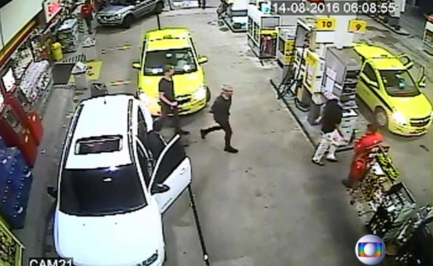 Security video shows three U.S. Olympic swimmers returning to their taxi at a gasoline station where they were accused by staff of having caused damage in Rio de Janeiro, Brazil, Aug. 14, 2016. 