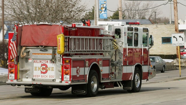A firetruck drives down a street en route to a call Jan. 31, 2005, in Arlington Heights, Illinois. 