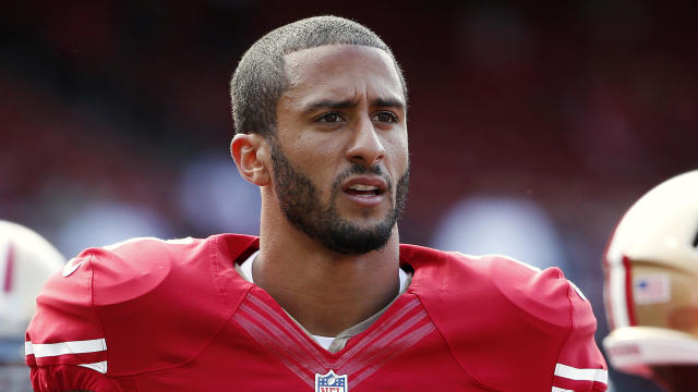 San Francisco 49ers quarterback Colin Kaepernick stands on the field before an NFL preseason football game against the Denver Broncos in San Francisco, California, August 8, 2013. 