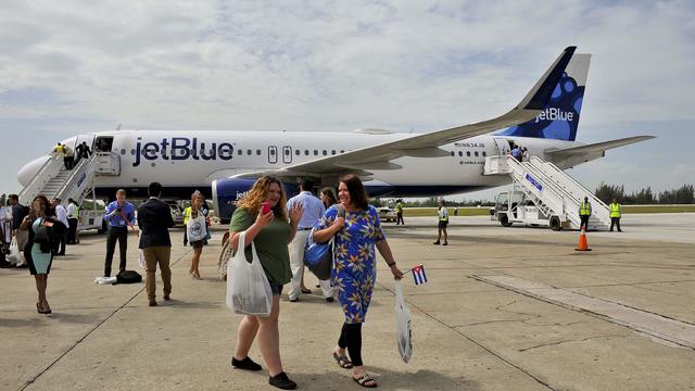 Passengers deplane upon arriving on a JetBlue flight from Fort Lauderdale at the airport of Santa Clara, Cuba 