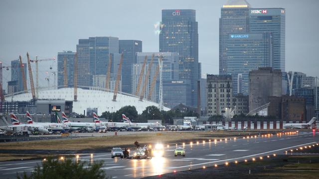 A photo tweeted by the Black Lives Matter U.K. protest group shows police surrounding a small group of protesters from the group on the runway of London City Airport 