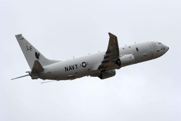 A U.S. Navy P-8 Poseidon aircraft flies out from Perth International Airport to assist with the international search effort trying to locate missing Malaysia Airways Flight 370 on April 16, 2014, in Perth, Australia. 