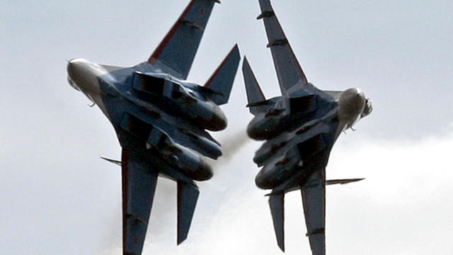 The Russian Strizhy (swifts) air force team flies Sukhoi Su-27 Flanker fighters during the International festival of flight groups at the Moscow International Air Show in Zhukovsky, in the Moscow region, Aug. 13, 2004. 