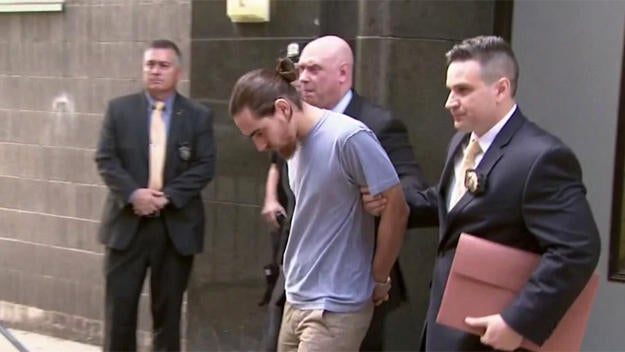 New York City detectives lead Broyoan Lopez out of the 25th Precinct stationhouse after his arrest in a brazen East Harlem robbery on Sept. 9, 2016. 