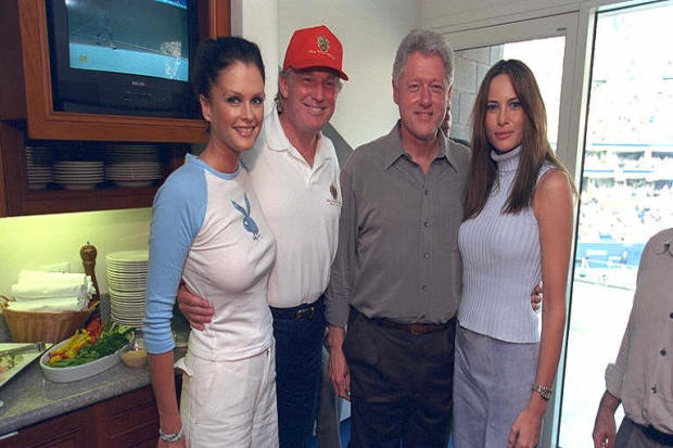 Donald Trump, President Clinton, Melania Knauss, right, who would later marry Trump, and Sports Illustrated swimsuit model Kylie Bax pose for a photo at the U.S. Open in Flushing, New York, on Sept. 8, 2000. 