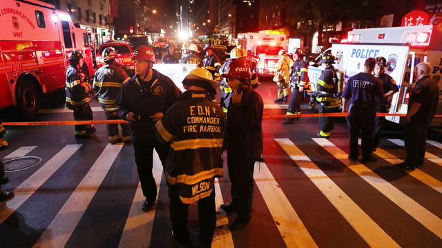 Police, firefighters and emergency workers gather at the scene of an explosion in Manhattan on Sept. 17, 2016, in New York City. The evening explosion at 23rd Street in the popular Chelsea neighborhood injured over two dozen people. 