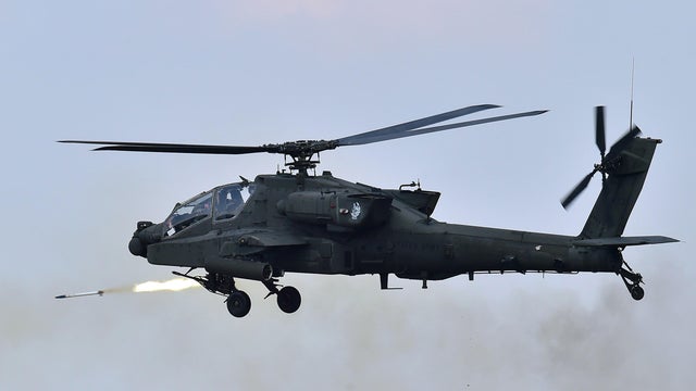 A U.S. AH-64 Apache helicopter fires rockets during a joint live firing drill between South Korea and the U.S. at the Seungjin Fire Training Field in Pocheon, South Korea, Aug. 28, 2015. 