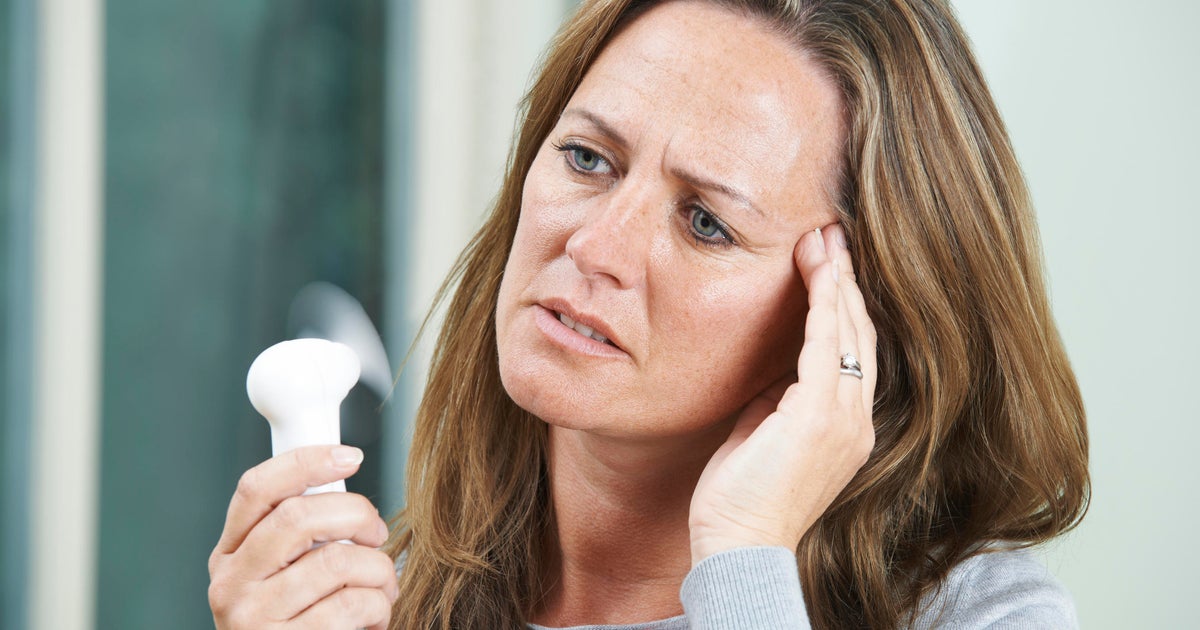 Genes may play a role in which women get hot flashes - CBS News