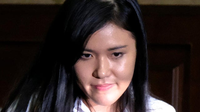 Jessica Kumala Wongso, who is accused of murdering her friend by poisoning her coffee with cyanide, walks after talking with her lawyer during her trial at the Central Jakarta Court in Jakarta, Indonesia, Oct. 27, 2016. 