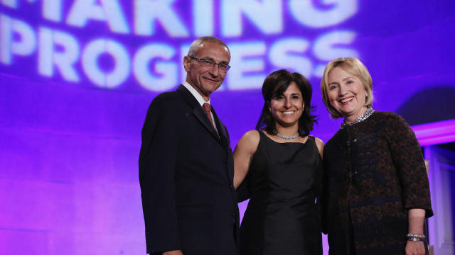 From left to right, Center for American Progress co-founder John Podesta, President Neera Tanden and former Secretary of State Hillary Clinton pose for photographs during a gala celebrating the 10th anniversary of the center at the Mellon Auditorium Oct. 