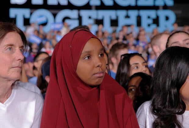 Audience members listen as Democratic presidential nominee Hillary Clinton speaks at a campaign rally at Arizona State University in Tempe, Arizona, Nov. 2, 2016.