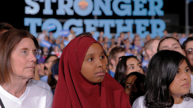 Audience members listen as Democratic presidential nominee Hillary Clinton speaks at a campaign rally at Arizona State University in Tempe, Arizona, Nov. 2, 2016. 