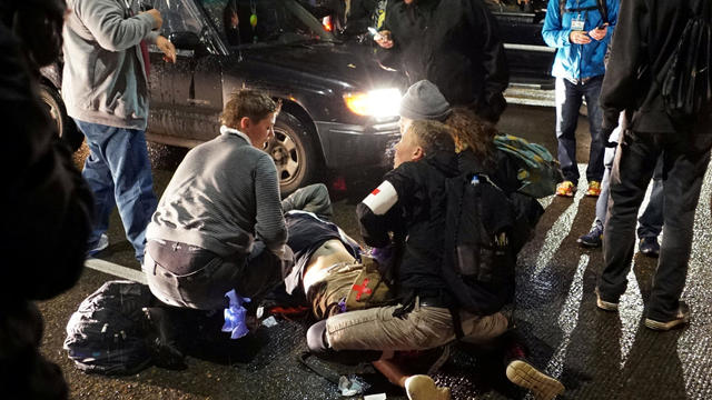 A demonstrator is treated for a gunshot wound during a protest against the election of Republican Donald Trump as president of the United States in Portland, Oregon, Nov. 12, 2016. 
