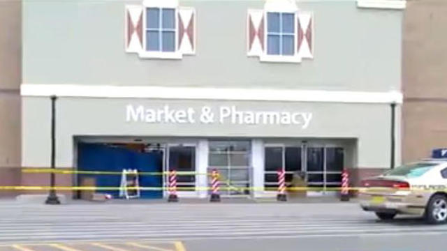 Crews work the scene after a pickup truck crashed into the front of a Walmart store in Pella, Iowa, on Dec. 1, 2016. 