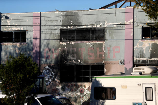 A charred wall is seen outside a warehouse after a fire broke out during an electronic dance party, resulting in at least nine deaths and many unaccounted for in the Fruitvale district of Oakland, California, Dec. 3, 2016. 