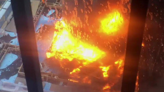 A fire burns at a hospital building under construction at NYU Langone Medical Center in the Manhattan borough of New York on Dec. 14, 2016, in this image capture from video posted to Twitter. 