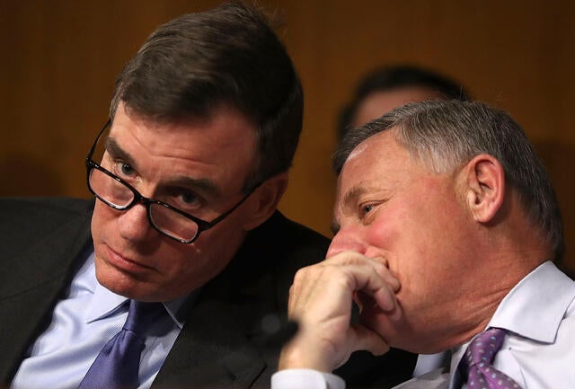Sen. Mark Warner, left, D-Virginia, vice chair of the Senate Select Committee on Intelligence, and Sen. Richard Burr, R-North Carolina, the committee’s chairman, speak in the Dirksen Senate Office Building on Capitol Hill Jan. 10, 2017, in Washington.
