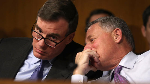 Sen. Mark Warner, left, D-Virginia, vice chair of the Senate Select Committee on Intelligence, and Sen. Richard Burr, R-North Carolina, the committee’s chairman, speak in the Dirksen Senate Office Building on Capitol Hill Jan. 10, 2017, in Washington. 