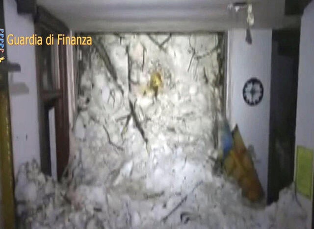 A photo taken from a video provided by Italy’s Finance Police shows the snow inside the Hotel Rigopiano in Farindola, central Italy, after it was hit by an avalanche Jan. 19, 2017. 