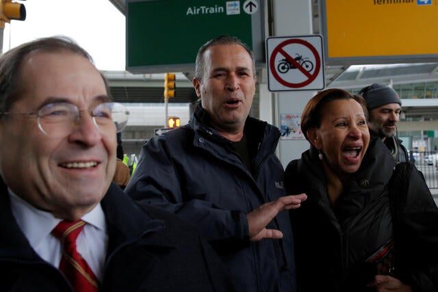 Iraqi immigrant Hameed Darweesh, center, walks out of Terminal 4 with U.S. Rep. Jerrold Nadler and U.S. Rep. Nydia Velazquez after being released at John F. Kennedy International Airport in Queens, New York, Jan. 28, 2017.