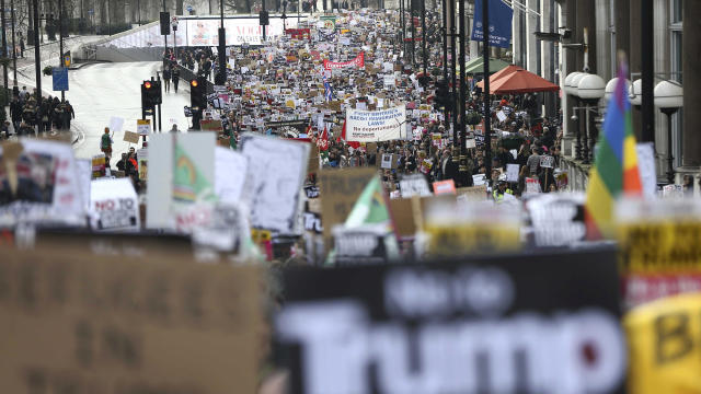 Demonstrators march against President Trump and his temporary ban on refugees and nationals from seven Muslim-majority countries from entering the United States during a protest in London Feb. 4, 2017. 