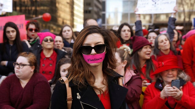 A woman with tape over her mouth takes part in a Day Without a Woman march on International Women&rsquo;s Day in New York March 8, 2017. 