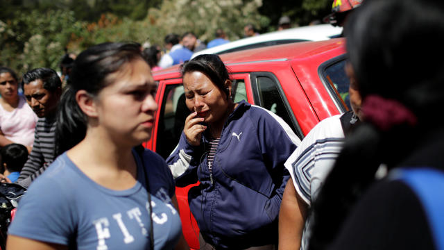 Family members react as they wait for news of their loved ones after a fire broke out at the Virgen de Asuncion home in San Jose Pinula, on the outskirts of Guatemala City, Guatemala, on March 8, 2017. 